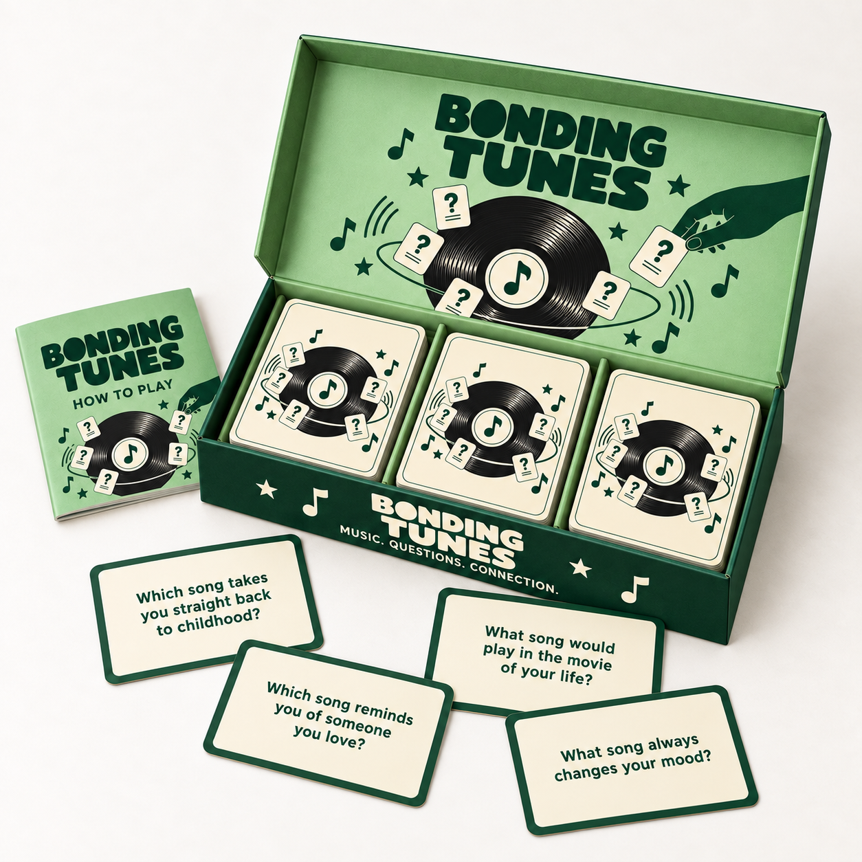 Open green Bonding Tunes box with three card decks and musical question cards